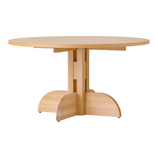 Natural wood round dining table with a smooth finish and a minimalist base design. Light beige tones highlight the grain.
