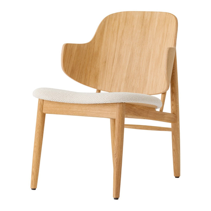 Light wood lounge chair with a smooth, minimalist design and a soft beige cushioned seat.