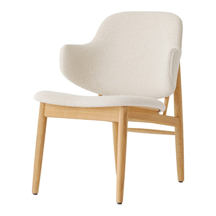 Cream upholstered chair with natural wood legs, featuring a simple, modern design and soft textures.