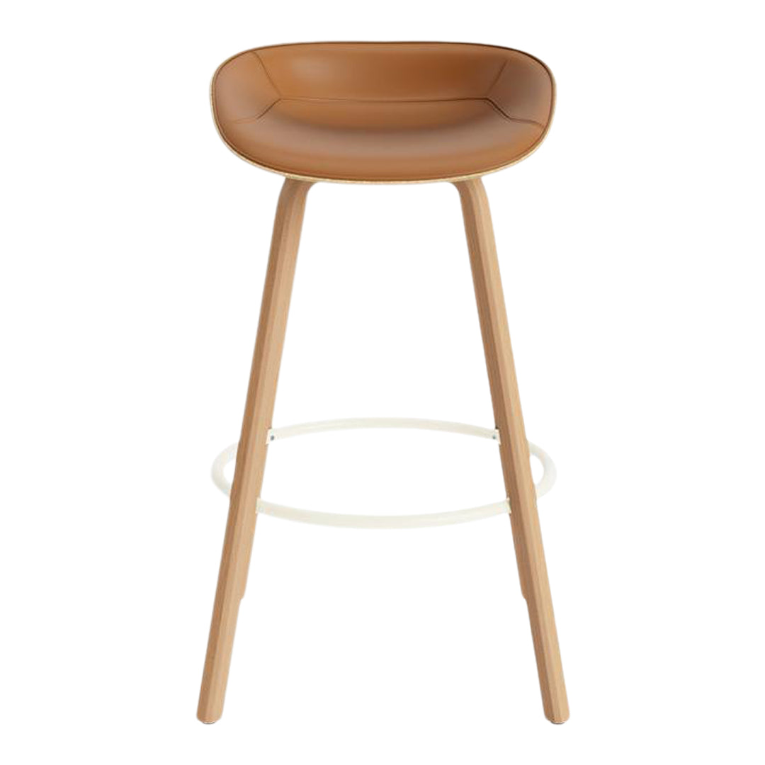 Tan leather bar stool with natural wood legs and a minimalist design, perfect for modern decor.
