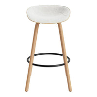 Light gray padded seat with natural wood legs and a black footrest, featuring a simple, modern design.