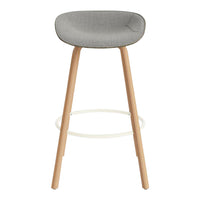 Gray upholstered bar stool with natural wood legs and minimalistic design. Perfect for modern interiors.