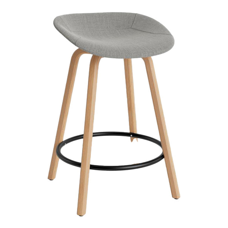 Gray upholstered bar stool with natural wood legs and a black metal footrest, featuring a simple, modern design.