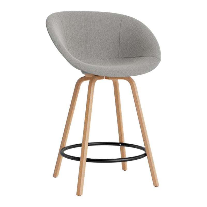 Gray upholstered bar stool with natural wood legs and a black metal footrest, featuring a smooth, minimalist design.