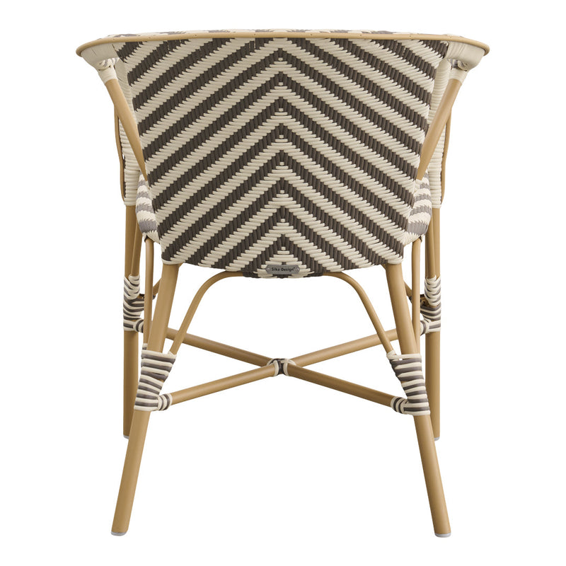 Chevron pattern in neutral tones of beige and dark brown on a stylish curved chair with a natural bamboo frame.