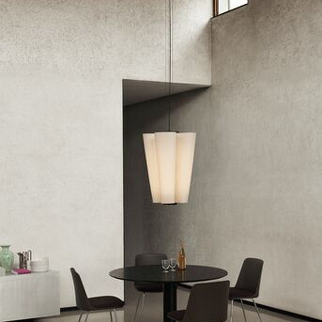 Elegant pendant lamp featuring a soft beige color and smooth, minimalist design against a textured gray wall.