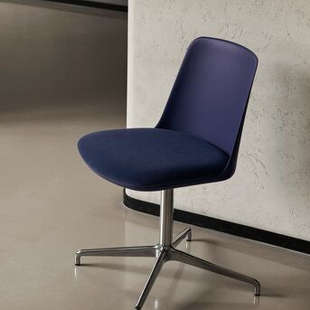 Navy blue upholstered chair with a smooth, modern design and a chrome base, perfect for contemporary interiors.