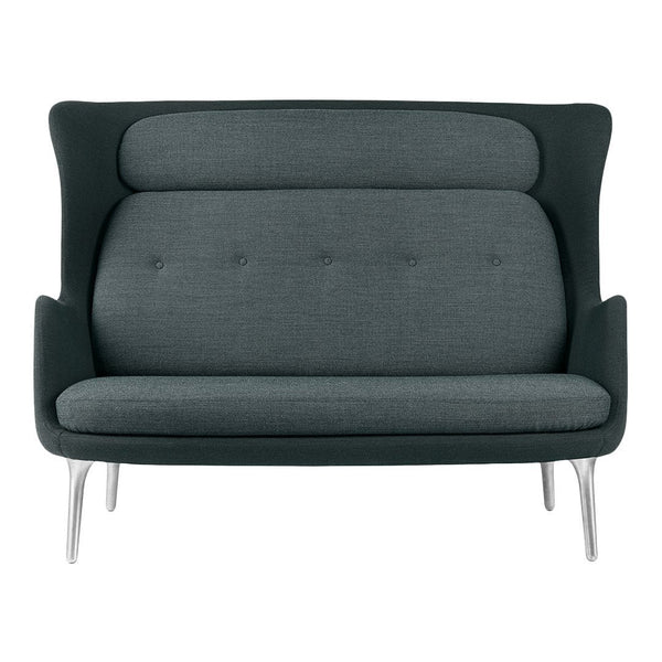 Gray upholstered loveseat with a smooth texture and subtle button detailing, featuring sleek metal legs.