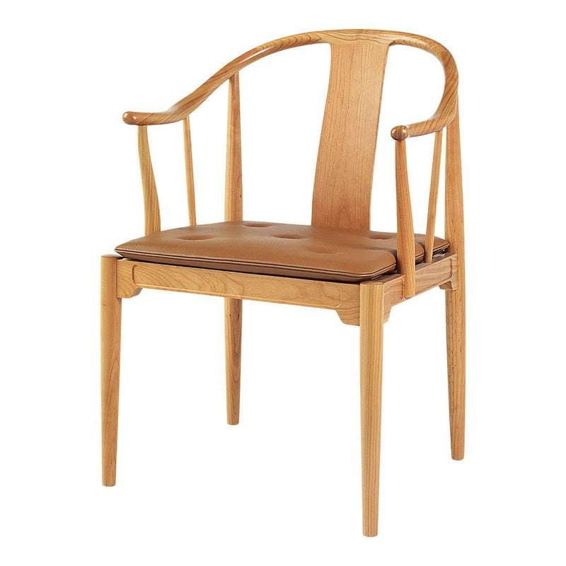 Light wood chair with a curved back and a brown leather seat, showcasing natural wood grain patterns.