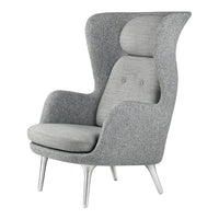Gray upholstered high-back chair with two-tone fabric and minimalist design, featuring sleek white legs.