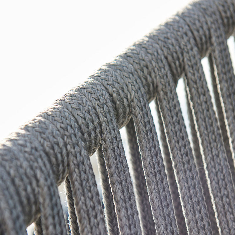 Gray woven rope close-up, showcasing a textured pattern and intricate detailing in a modern design.