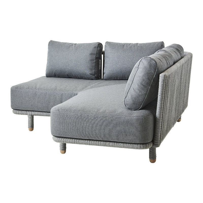 Gray sectional sofa with a textured fabric pattern and plush cushions, featuring natural wood legs. Stylish and modern design.