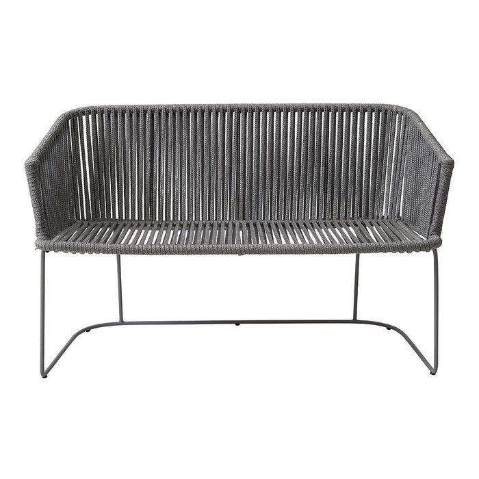 Gray woven outdoor couch with sleek lines and modern design, featuring a ribbed pattern and metal frame.