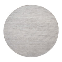 Round area rug in a soft gray hue with a subtle textured pattern, ideal for modern decor.