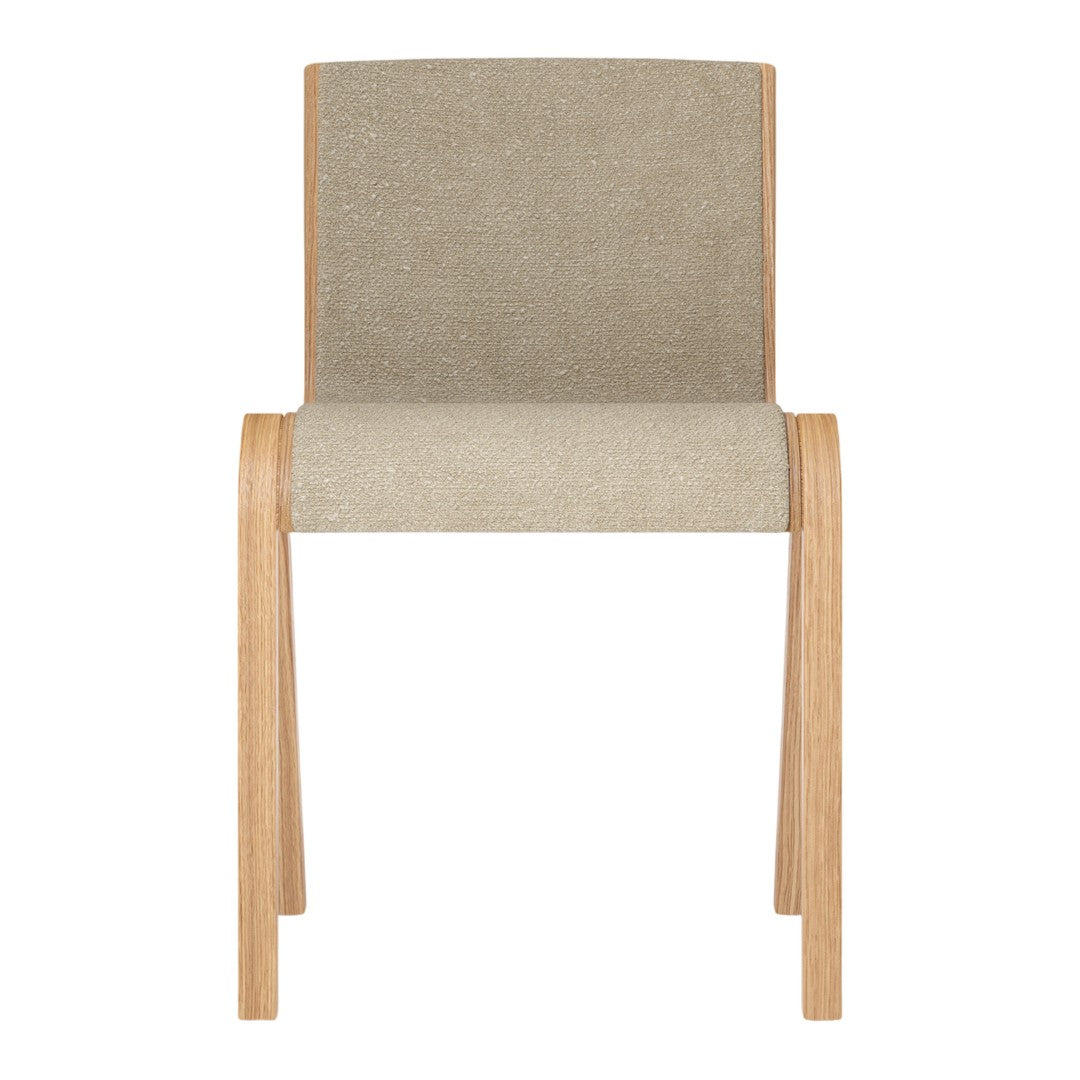 Beige upholstered chair with a smooth texture and natural wood legs. Simple and modern design with neutral tones.