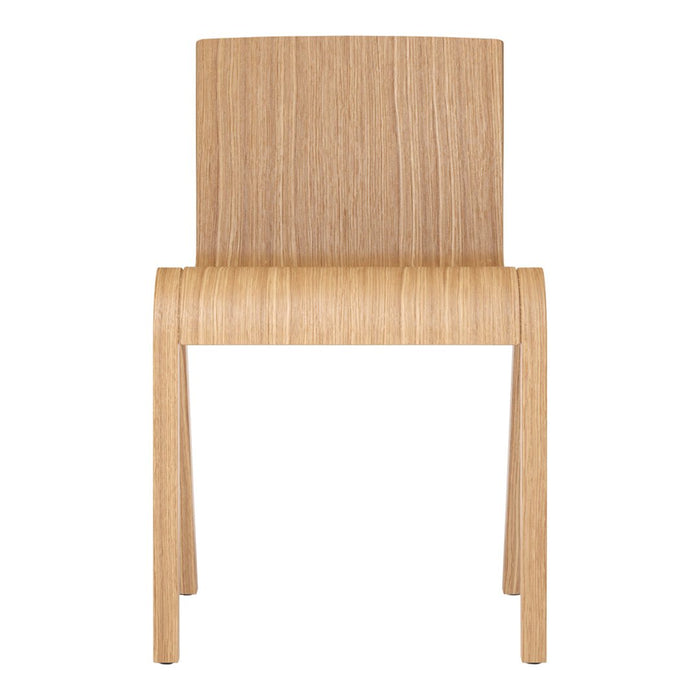 Natural light oak chair with a smooth, minimalist design and subtle wood grain pattern. Perfect for modern decor.