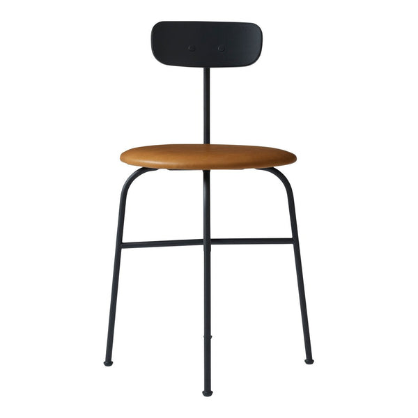 Black metal frame with a warm brown seat; modern minimalist chair design, perfect for contemporary decor.