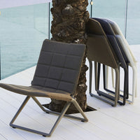 Stylish folding chairs in gray, taupe, and white with a modern quilted pattern, perfect for outdoor settings.