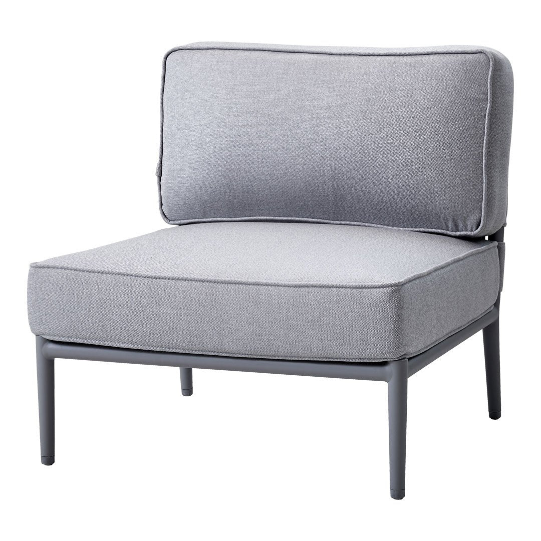 Gray cushioned chair with a minimalist design and solid fabric pattern, featuring a sleek metal frame.