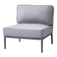 Gray cushioned chair with a minimalist design and solid fabric pattern, featuring a sleek metal frame.