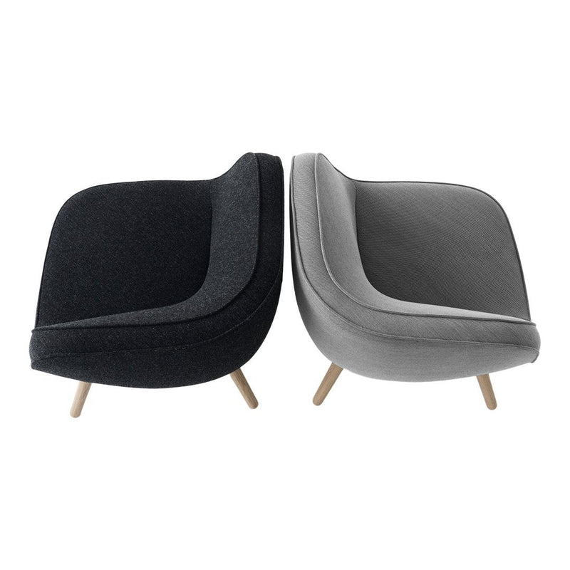 Stylish two-tone chairs in dark gray and light gray, featuring smooth curves and a sleek fabric texture.