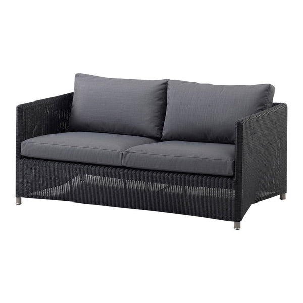 Stylish black wicker sofa with gray cushions, featuring a modern, minimalist design and subtle texture.