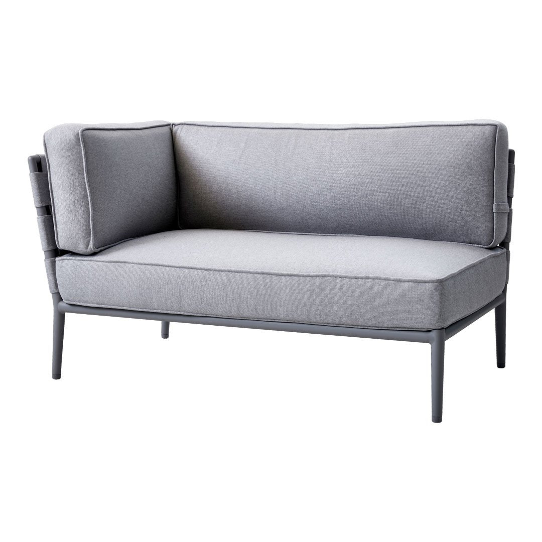 Gray upholstered loveseat with clean lines and subtle texture. Features a modern design and sleek metal frame.