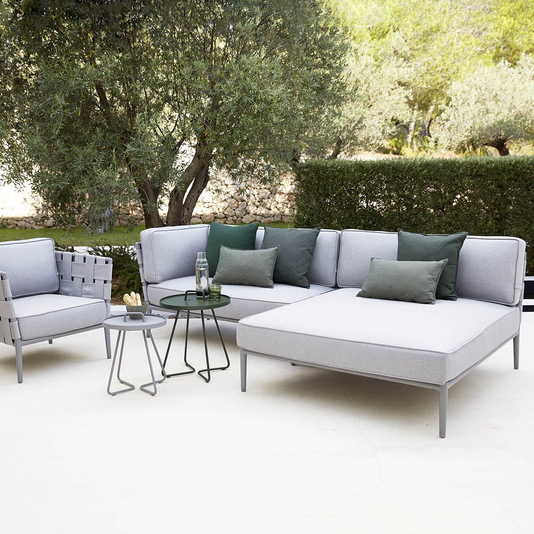 Modern outdoor sofa set in light gray with dark green accents and plush cushions, featuring a sleek design and minimal patterns.