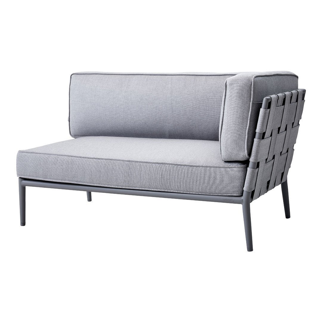 Gray two-seater sofa with sleek lines and a woven back design, perfect for modern outdoor spaces.