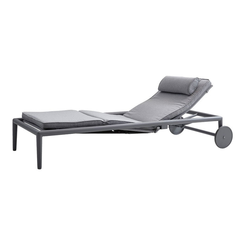 Gray lounge chair with a sleek, modern design and textured upholstery, featuring a comfortable headrest and minimalist frame.