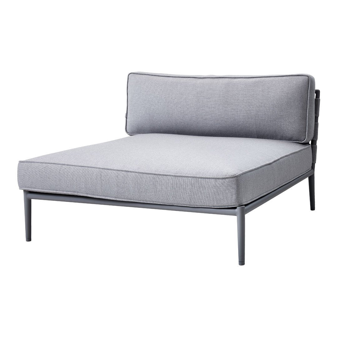 Gray lounge chair with a sleek, minimalistic design and contrasting dark metal frame. Perfect for modern decor.