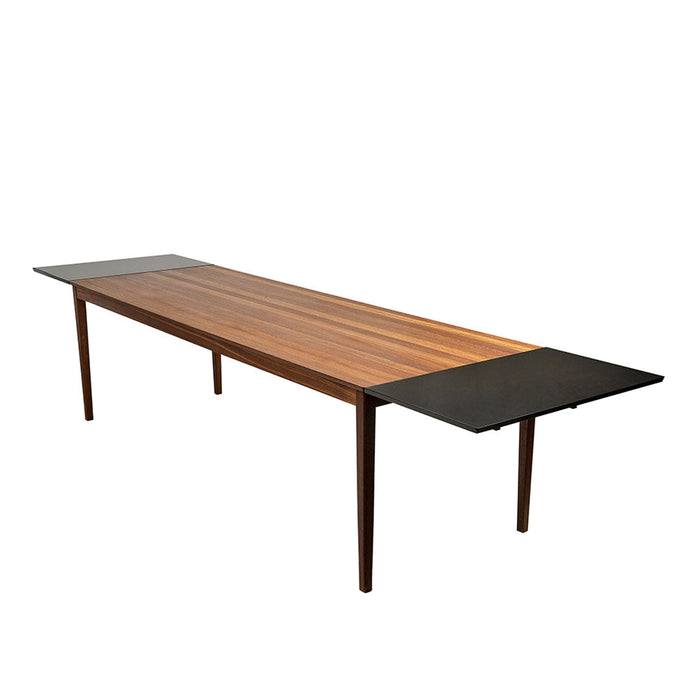 Wooden dining table with rich brown stripes and sleek black side panels, combining modern elegance with natural texture.