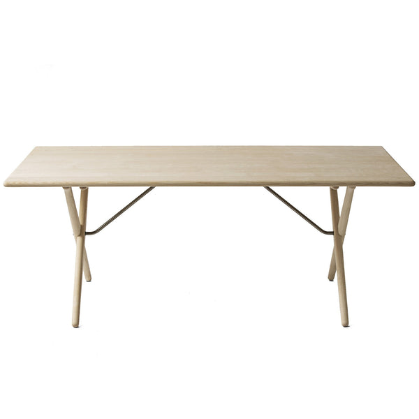 Light natural wood table with a smooth, minimal design and neutral tones, perfect for any modern space.