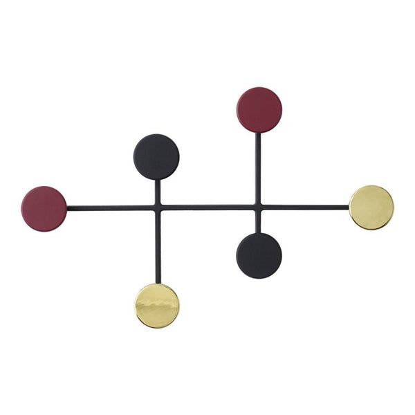 Abstract wall decor featuring black, gold, burgundy, and deep red circles in a modern geometric arrangement.
