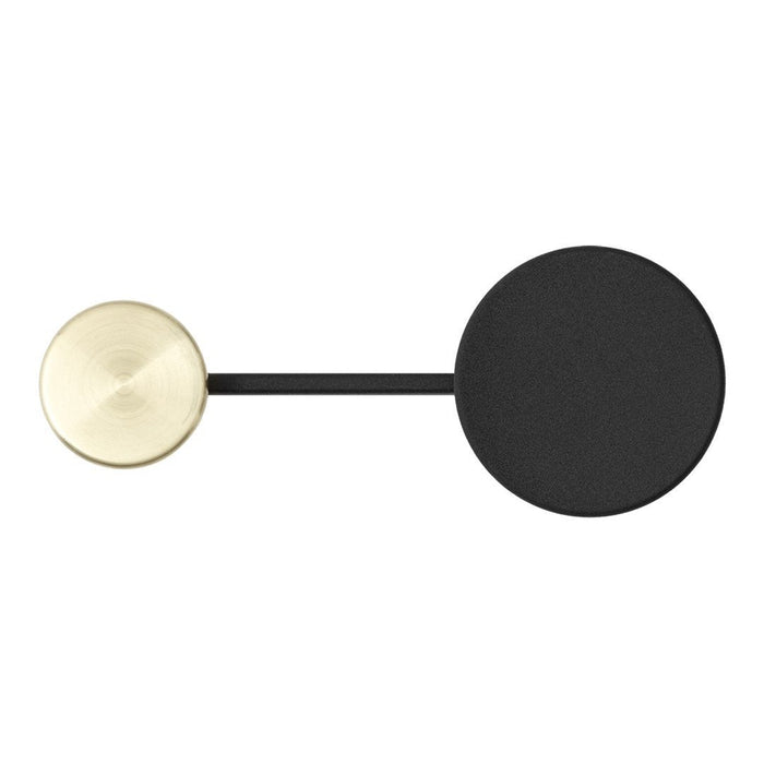 Gold and black geometric earring with contrasting smooth and matte finishes, showcasing a modern minimalist design.