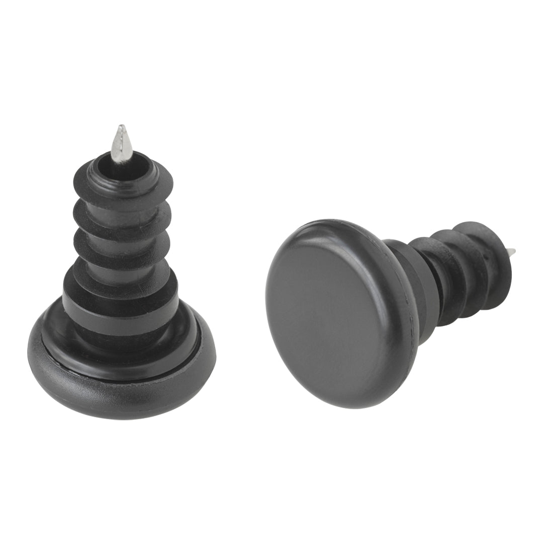 Black rubber stoppers with textured patterns and sharp tips, ideal for furniture protection and floor maintenance.