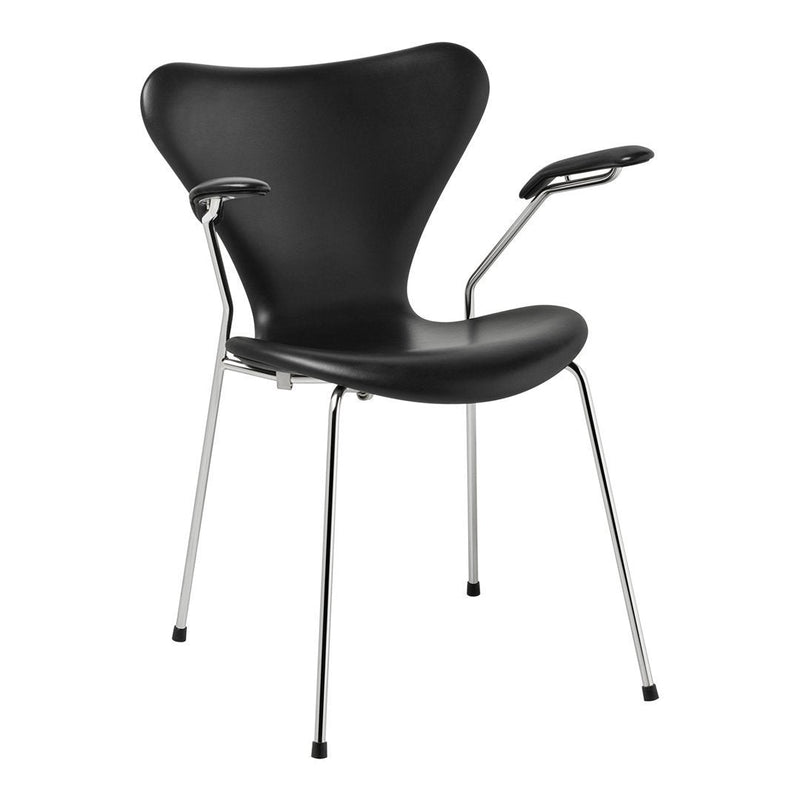 Black modern chair with sleek curves and chrome legs, featuring a minimalist design and smooth surface.