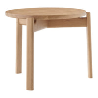Natural wood round side table with a smooth finish and minimalist design, featuring light oak tones and no visible patterns.