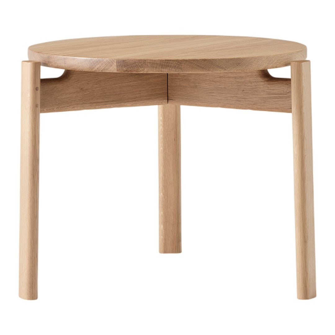 Light oak round side table with a smooth surface and minimalist design. Natural wood grain pattern adds a warm touch.