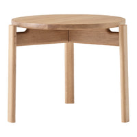 Light oak round side table with a smooth surface and minimalist design. Natural wood grain pattern adds a warm touch.