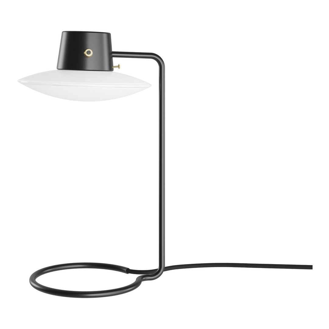 Black and white modern table lamp with sleek lines and minimalist design, featuring a smooth glass shade.