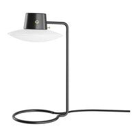 Black and white modern table lamp with sleek lines and minimalist design, featuring a smooth glass shade.