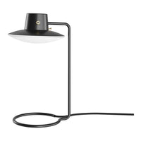 Black and white modern desk lamp with a sleek metal base and circular pattern. Stylish minimalist design for any space.