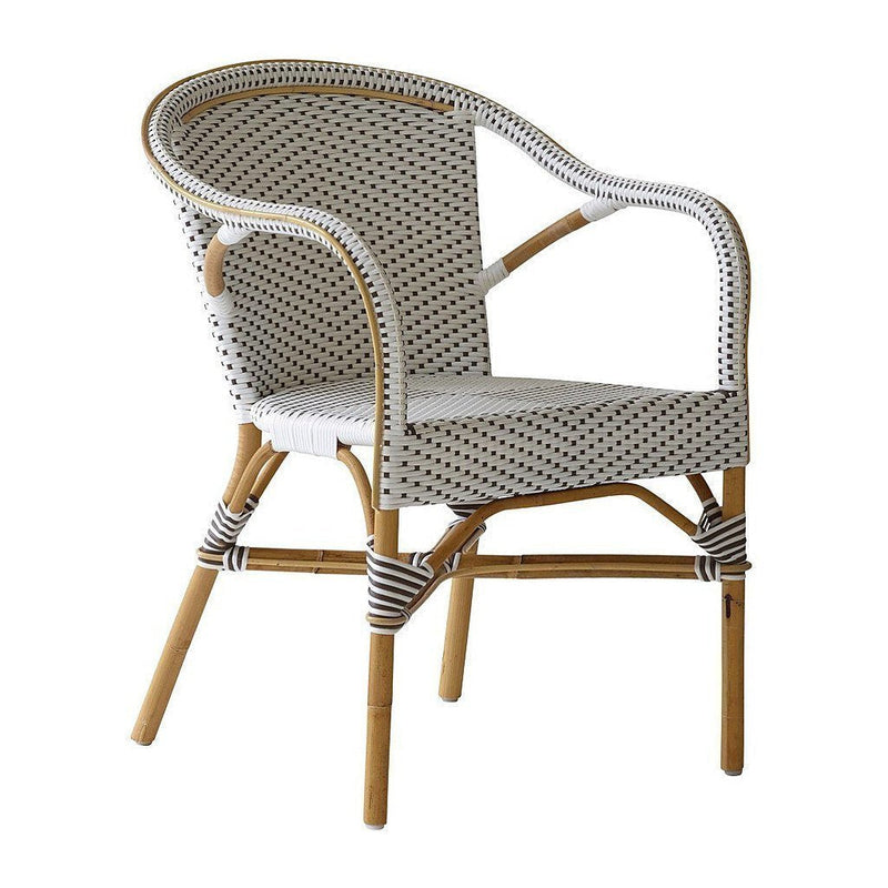 White woven chair with a polka dot pattern and natural bamboo legs, featuring a stylish and modern design.