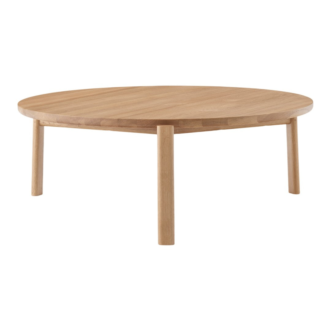 Round wooden coffee table in natural bamboo finish with a smooth, simple design and clean lines.