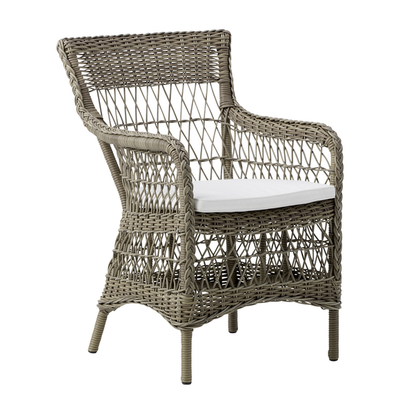 Light taupe wicker chair with a patterned backrest and white cushion, perfect for indoor or outdoor decor.