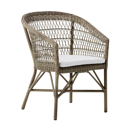 Woven rattan chair in natural tones with a contrasting white cushion for a stylish, modern look.