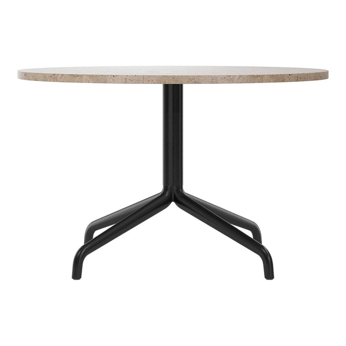 Round table with a beige stone top and sleek black metal base, showcasing a minimalist design.