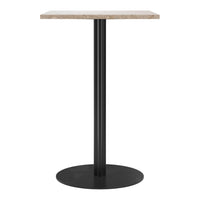 Black metal base with a light beige, textured top; modern design for versatile decor style.