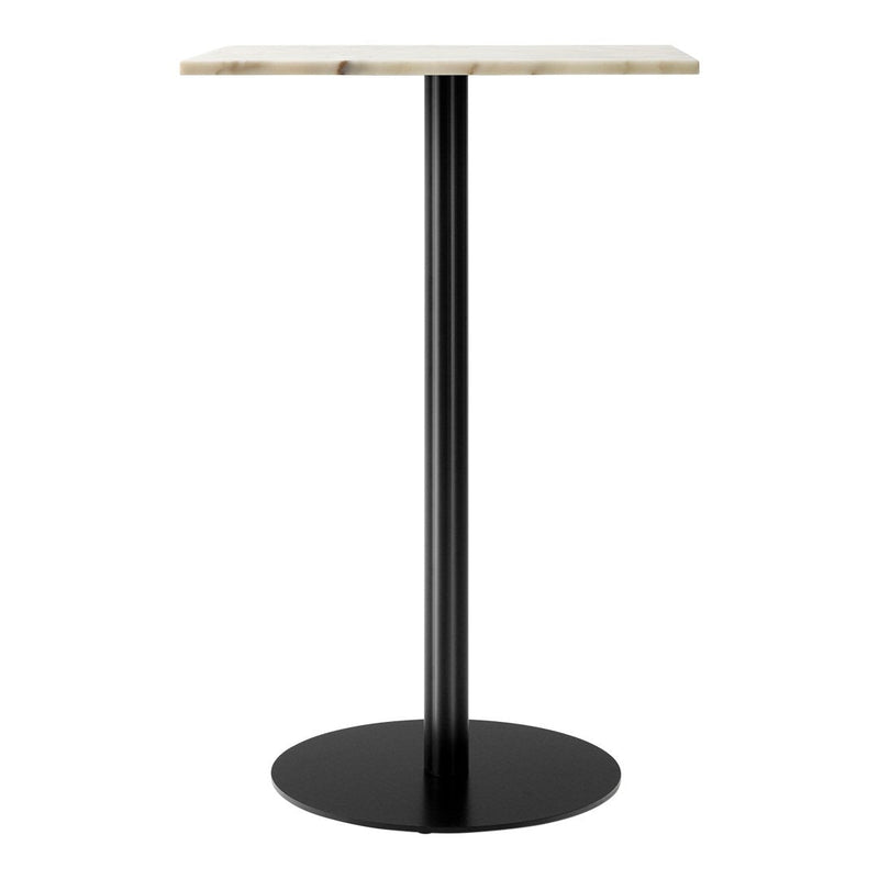 Modern table with a sleek black base and a textured light-colored top. Ideal for contemporary decor.
